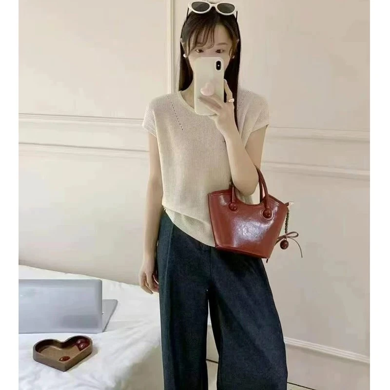 夏季花米色后背扣子设计款百搭宽松镂空气质冰感针织上衣