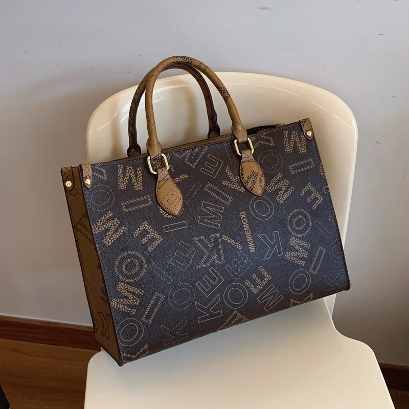 高级感包包女士2025新款时尚外出手提旅行包大容量通勤百搭托特包