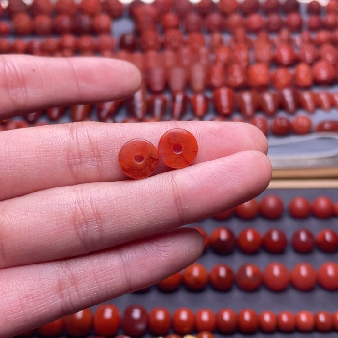 禹***立南红玛瑙未镶嵌其他W9.8瓦西柿子红带火焰隔片一对