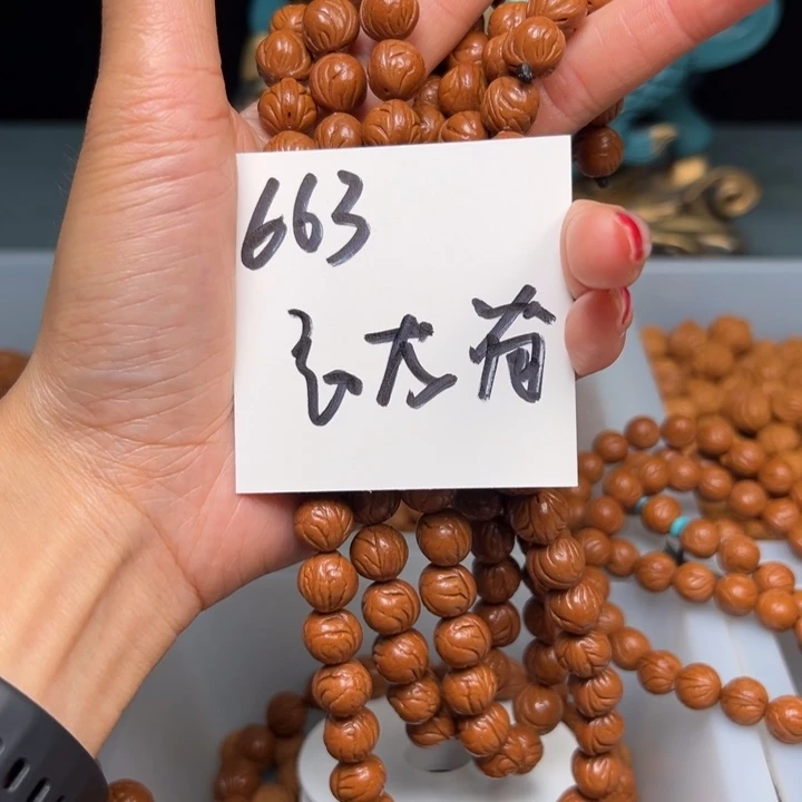 桃核把件看**我秦岭野生龙纹桃核玉龙脊