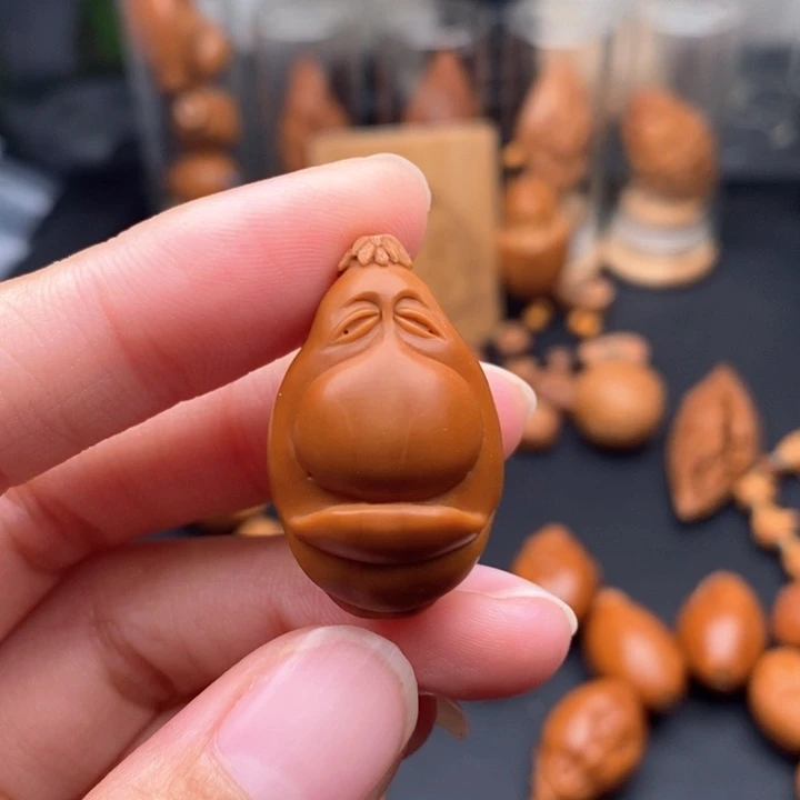 勇***仔橄榄核吊坠红料表情包