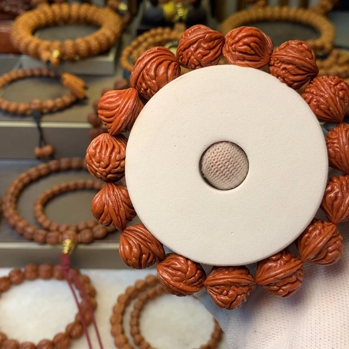 奚***好手串桃核秦岭龙纹