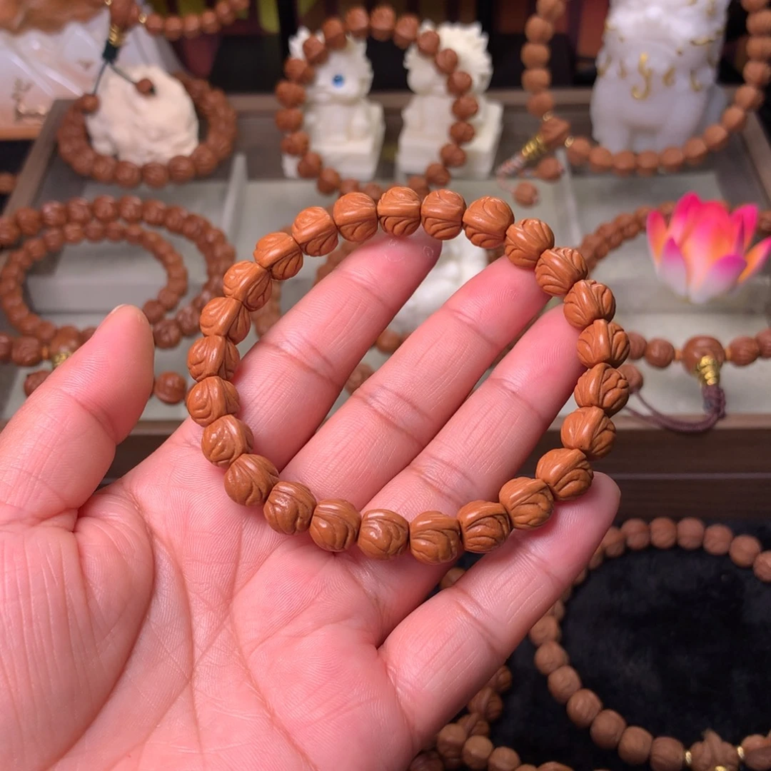 一***间桃核吊坠金玉龙手串10