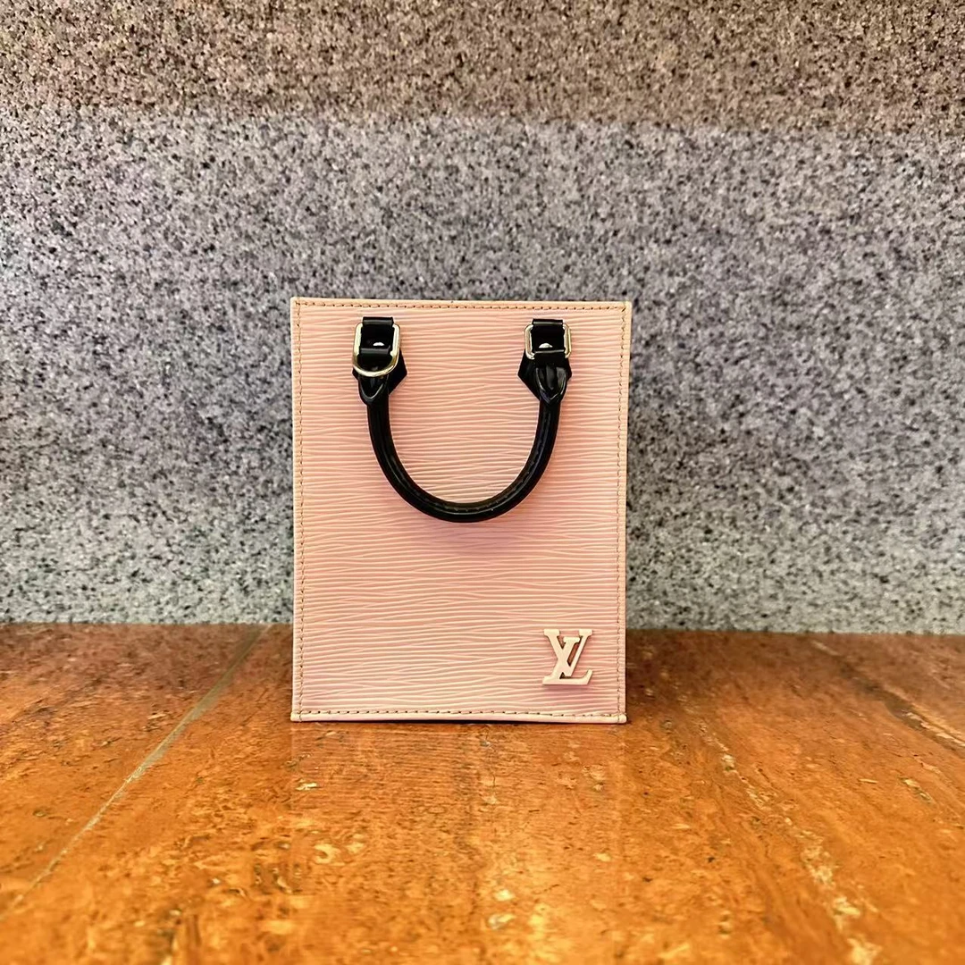 95新 LouisVuitton/路易威登 粉色水波纹琴谱斜挎手提包