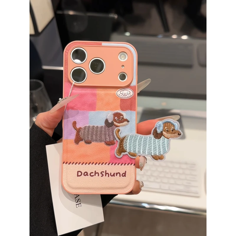 耳机小狗适用苹果17pro手机壳16PM肤感皮纹小众防摔华为p70小米15