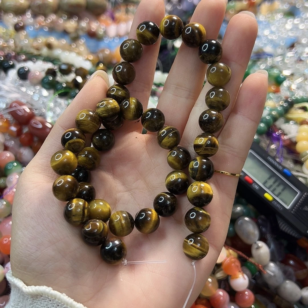 玛瑙/玉髓合金珠宝半成品黄虎眼。卡10。圆珠。一条