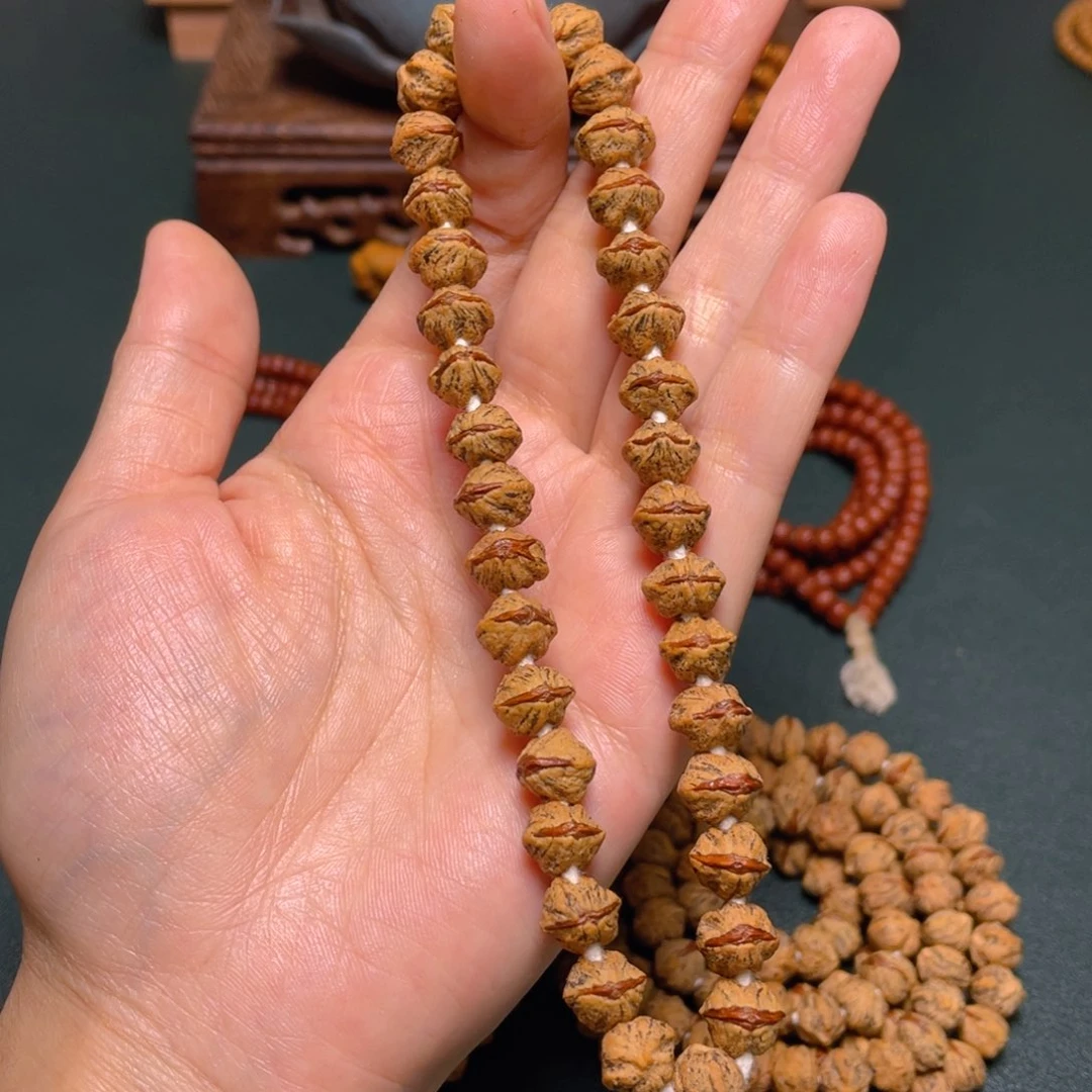 柏香籽/百香籽吊坠新款红牙手持