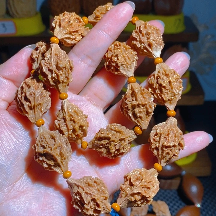 野生麒麟眼橄榄核手持2.0×16颗