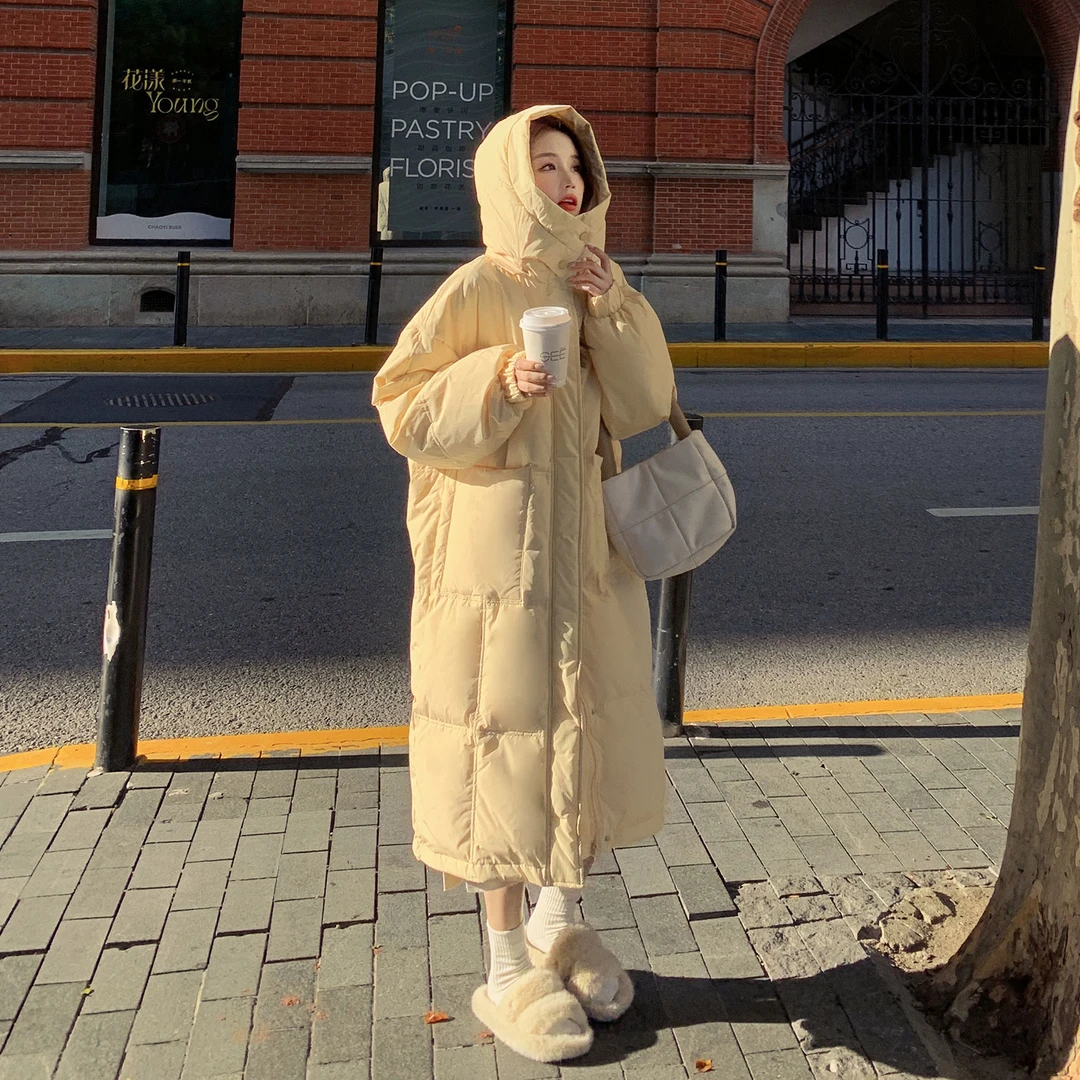 黄色连帽长款羽绒服女冬2025新款气质温柔风90白鸭绒面包服外套