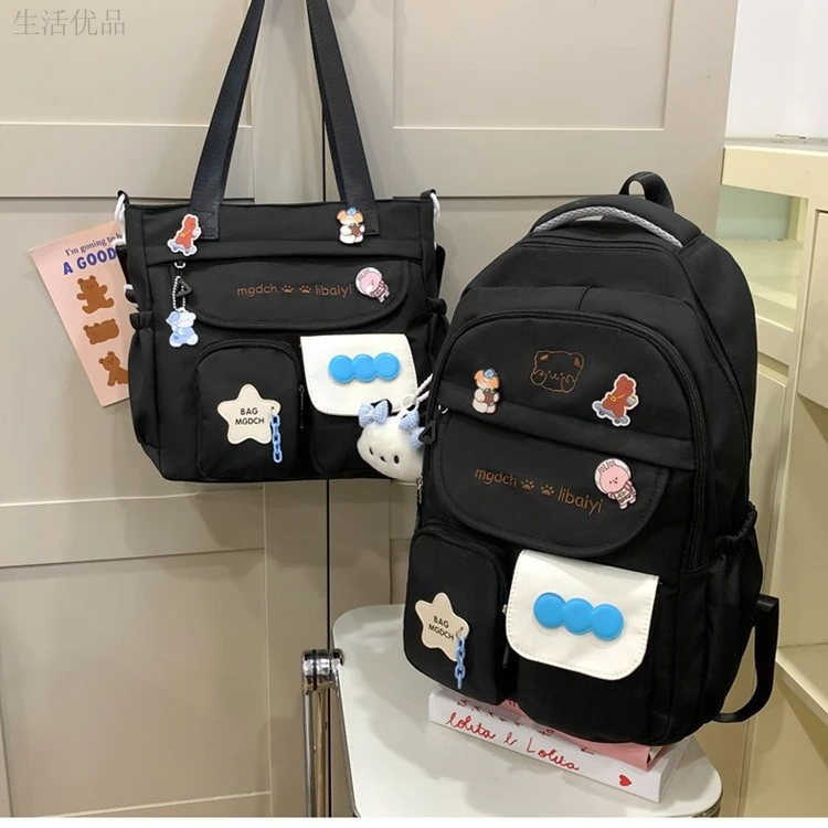 新款大容量拼接色书包韩版潮流耐磨防水小学生双肩包袋