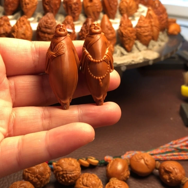 李***超橄榄核吊坠橄榄核雕刻的单子