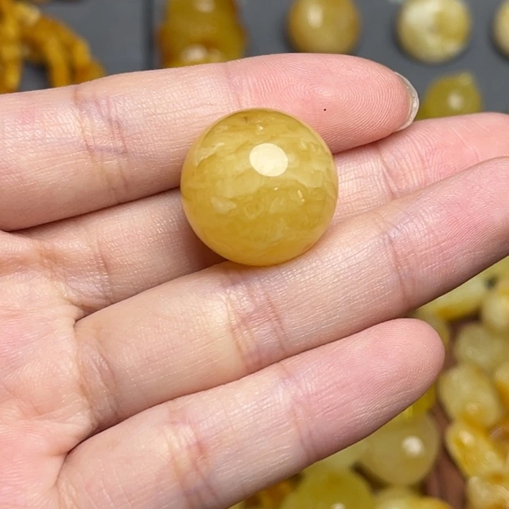 或***晚蜜蜡未镶嵌裸石有瑕妖花圆珠