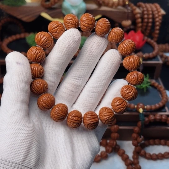 吊坠桃核颩***亾15龙纹凤羽手串