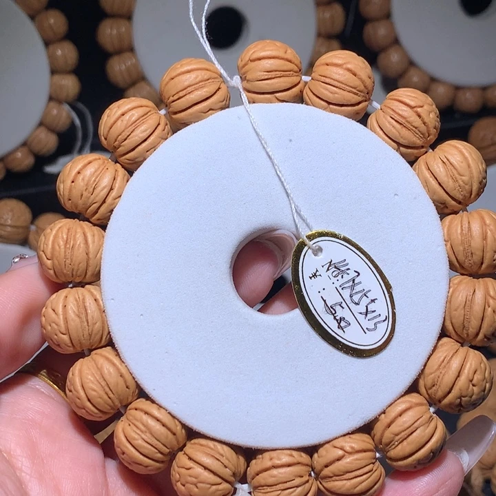 T***6桃核手串正圆金丹