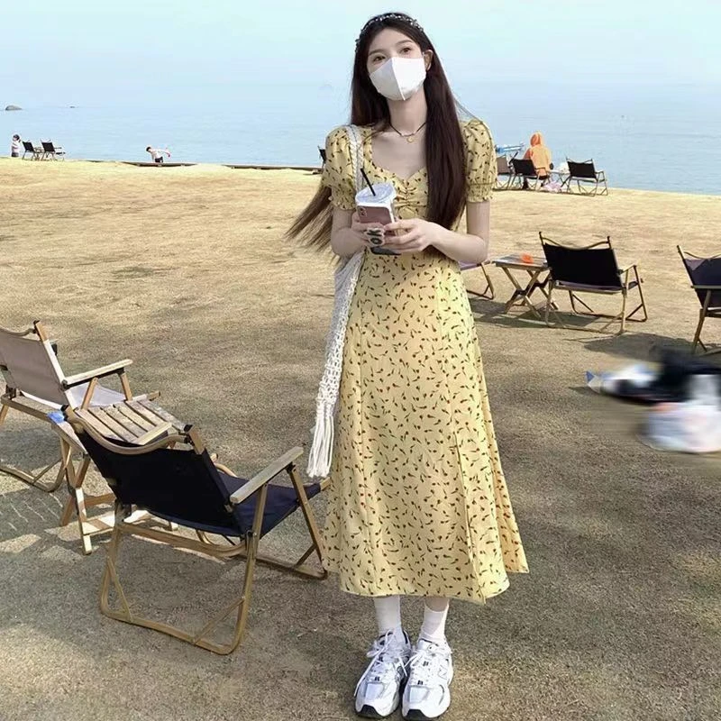 黄色优雅气质碎花裙女新款显瘦高腰开叉中长连衣裙广州