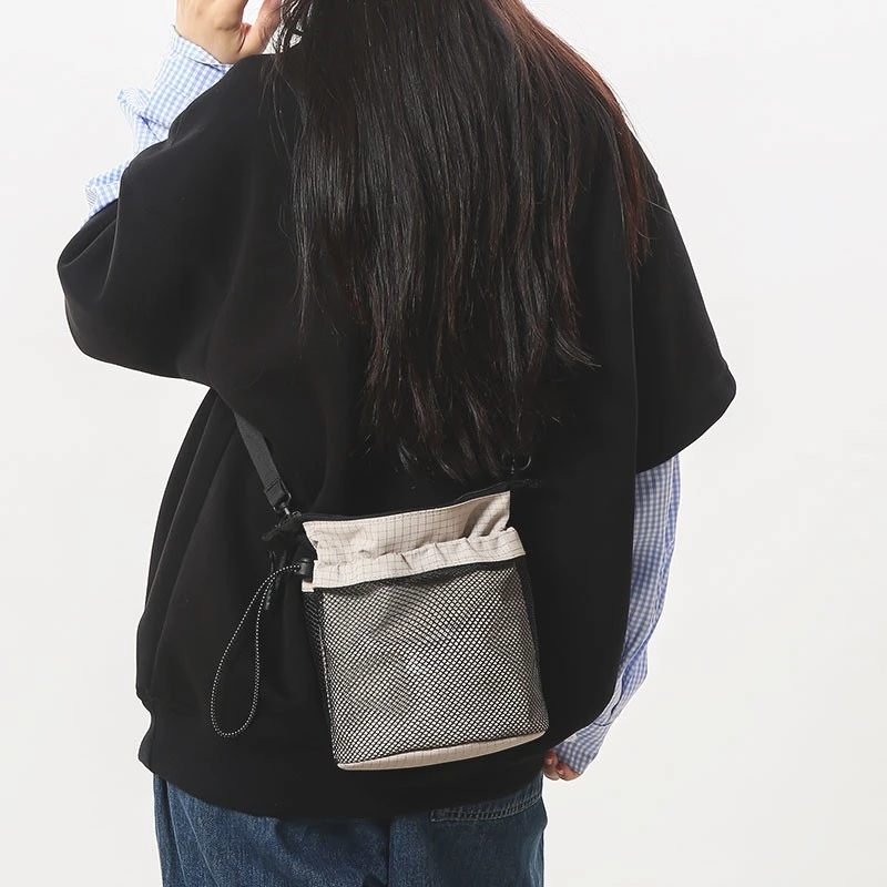 日系休闲斜挎包女2025新款时尚百搭通勤运动工装单肩包男手机包潮