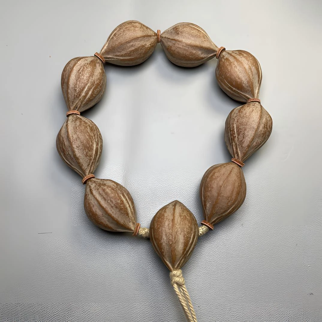 2131梅林铁蒜头 橄榄核素串