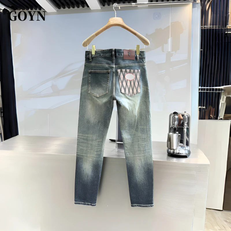 GOYN2025秋季轻奢潮牌高级感男士菱纹格印花修身小脚男装牛仔长裤