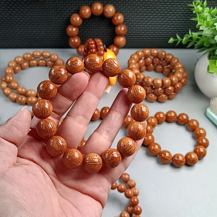 桃核手串铁籽密纹黄皮15@