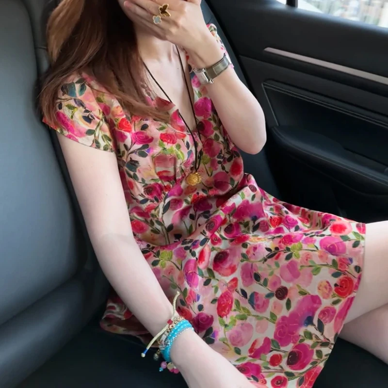 2025年夏季新款印花设计感侧开叉中长款短袖衬衫女生气质减龄上衣