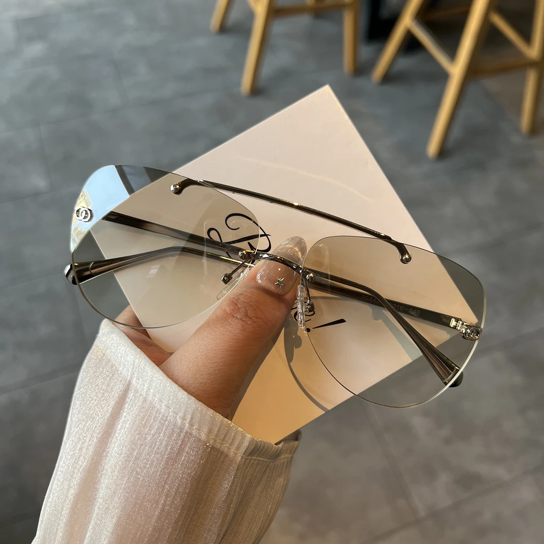 2025新款无框猫眼墨镜女高级感防紫外线开车专用素颜神器太阳眼镜