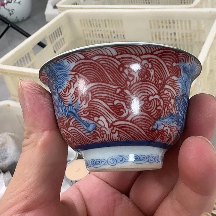 瓷片釉里红麒麟踏浪压手客杯