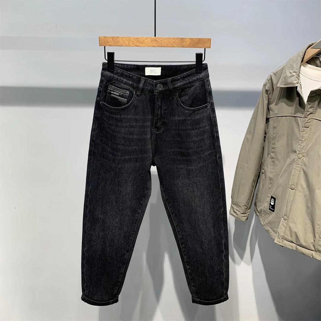 欧洲站2026冬季新款男士黑色水洗磨毛加厚牛仔裤青年时尚韩版百搭