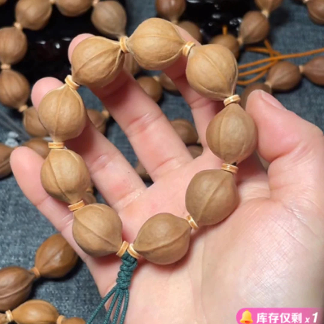 1823梅林铁三花橄榄素核原皮手串