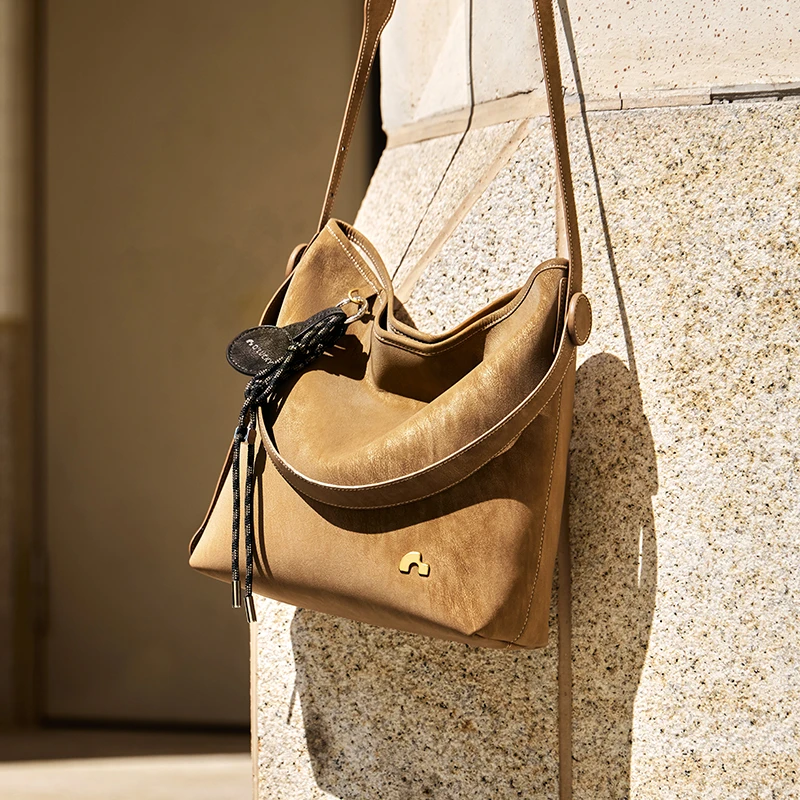 NALANDU纳兰杜晚风休闲通勤植鞣真皮水桶女包包女休闲大容量女款