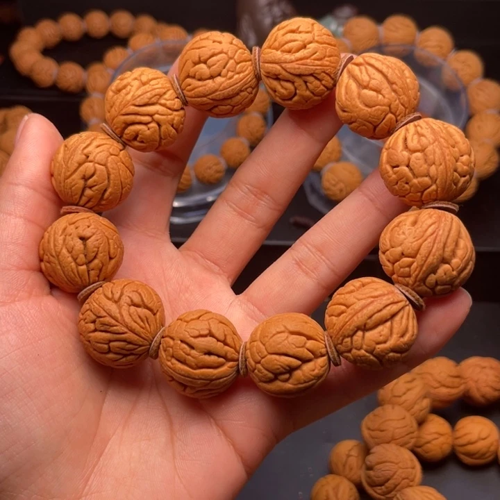 桃核手串金丝龙珠22