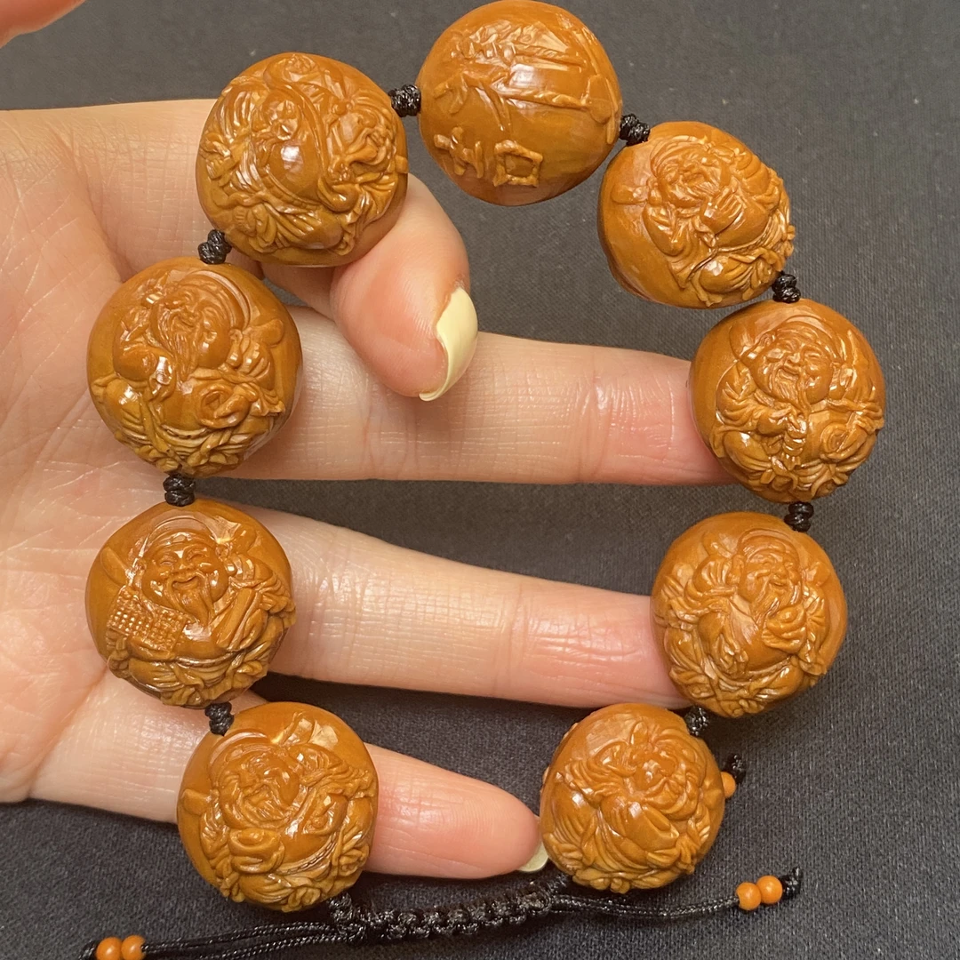 橄榄核雕刻吉象财神2.1cm