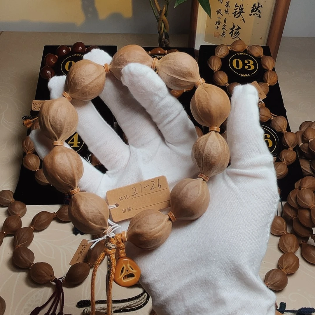 A***发橄榄核手串梅林铁核21*26