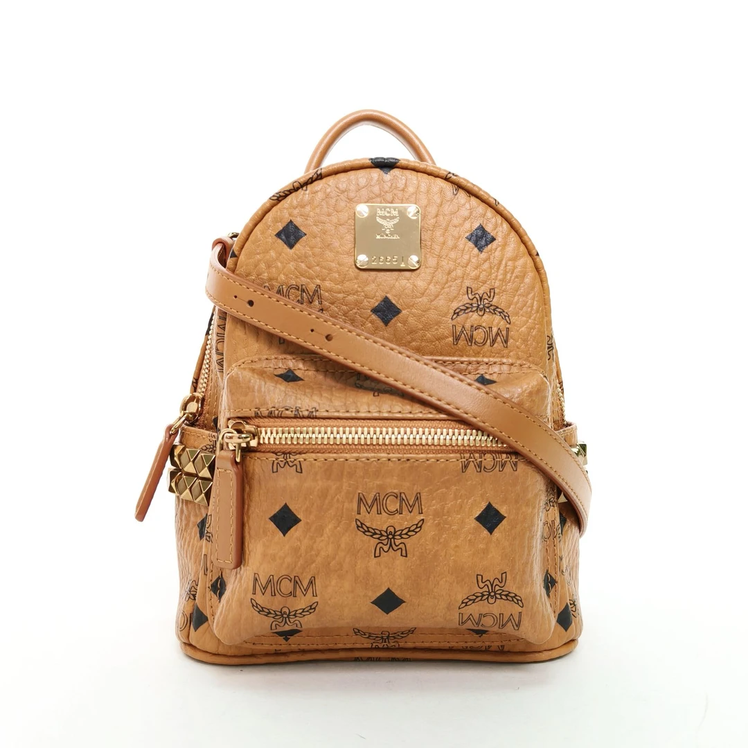 99新 MCM 小花柳侧边铆钉 双肩包 MINI 干邑色 皮革C