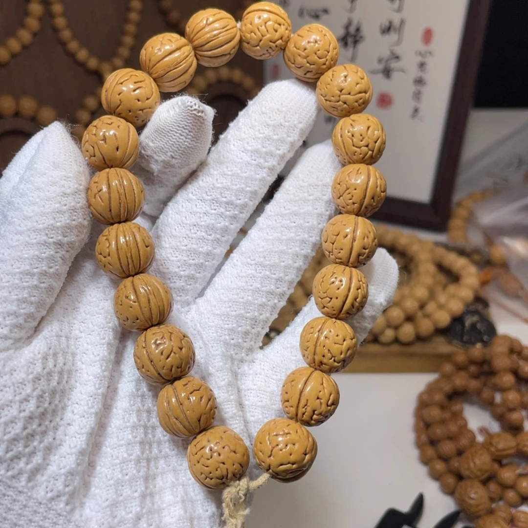 潇***）桃核吊坠野生盘锦