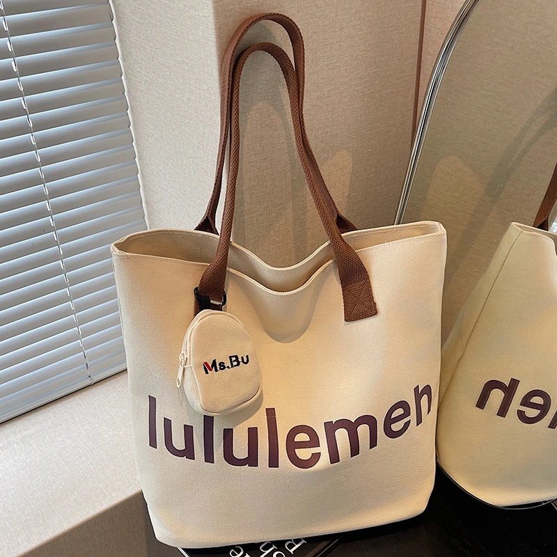 休闲大容量帆布包包女式2025新款轻便百搭单肩包大学生通勤托特包