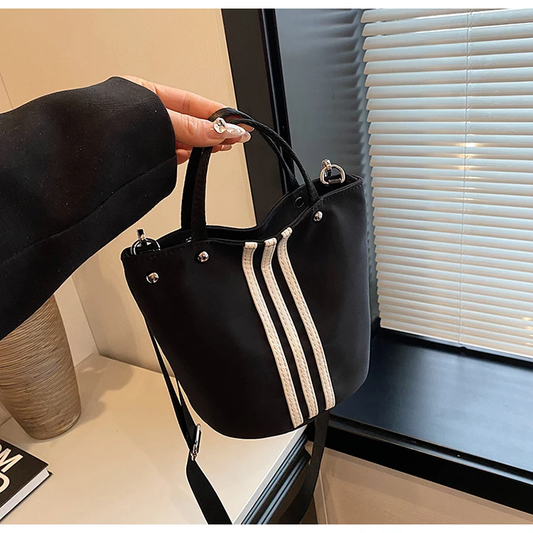 简约休闲水桶包包女2025新款潮尼龙布手提包大容量通勤单肩斜挎包