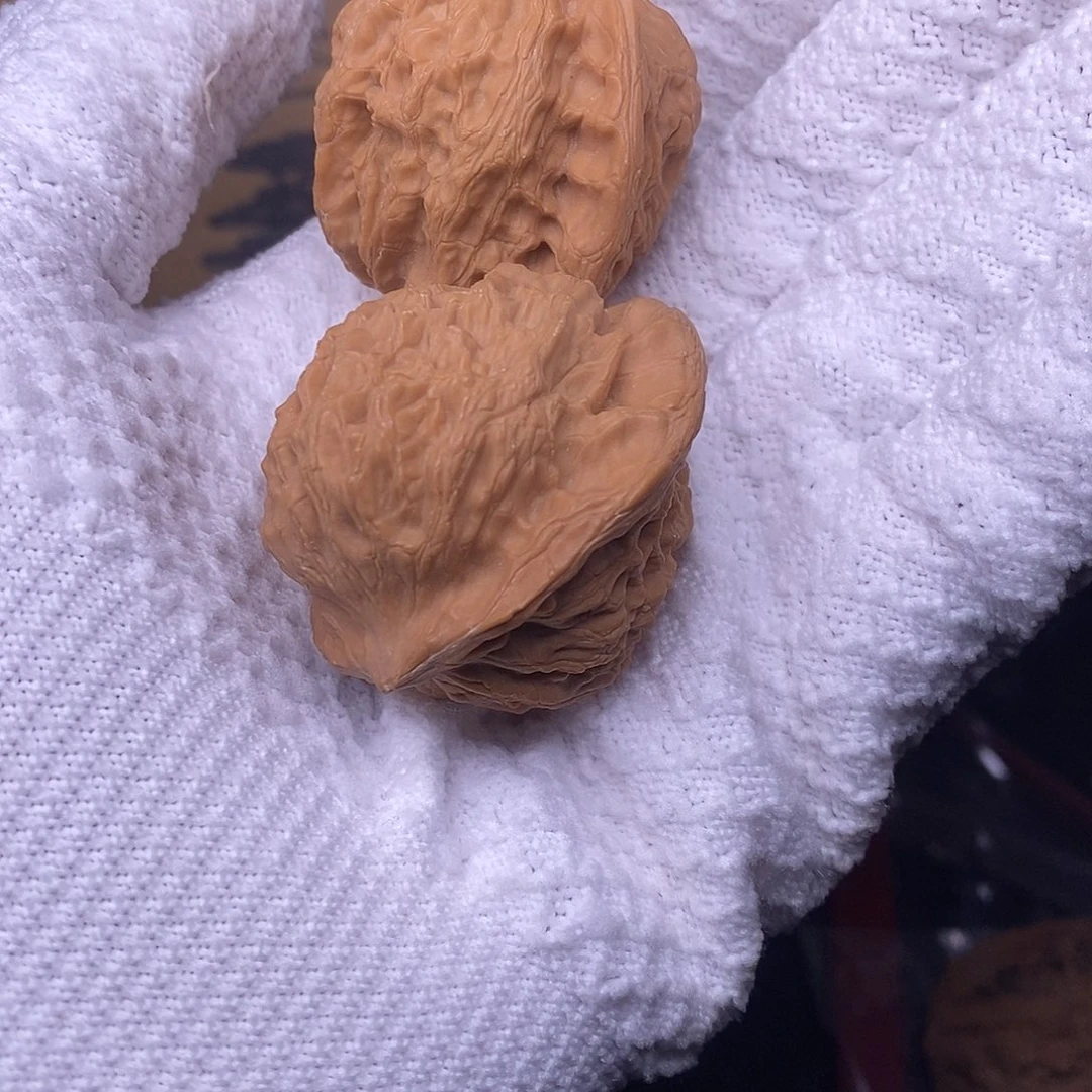 桃核把件馒*崔凯公子帽核桃