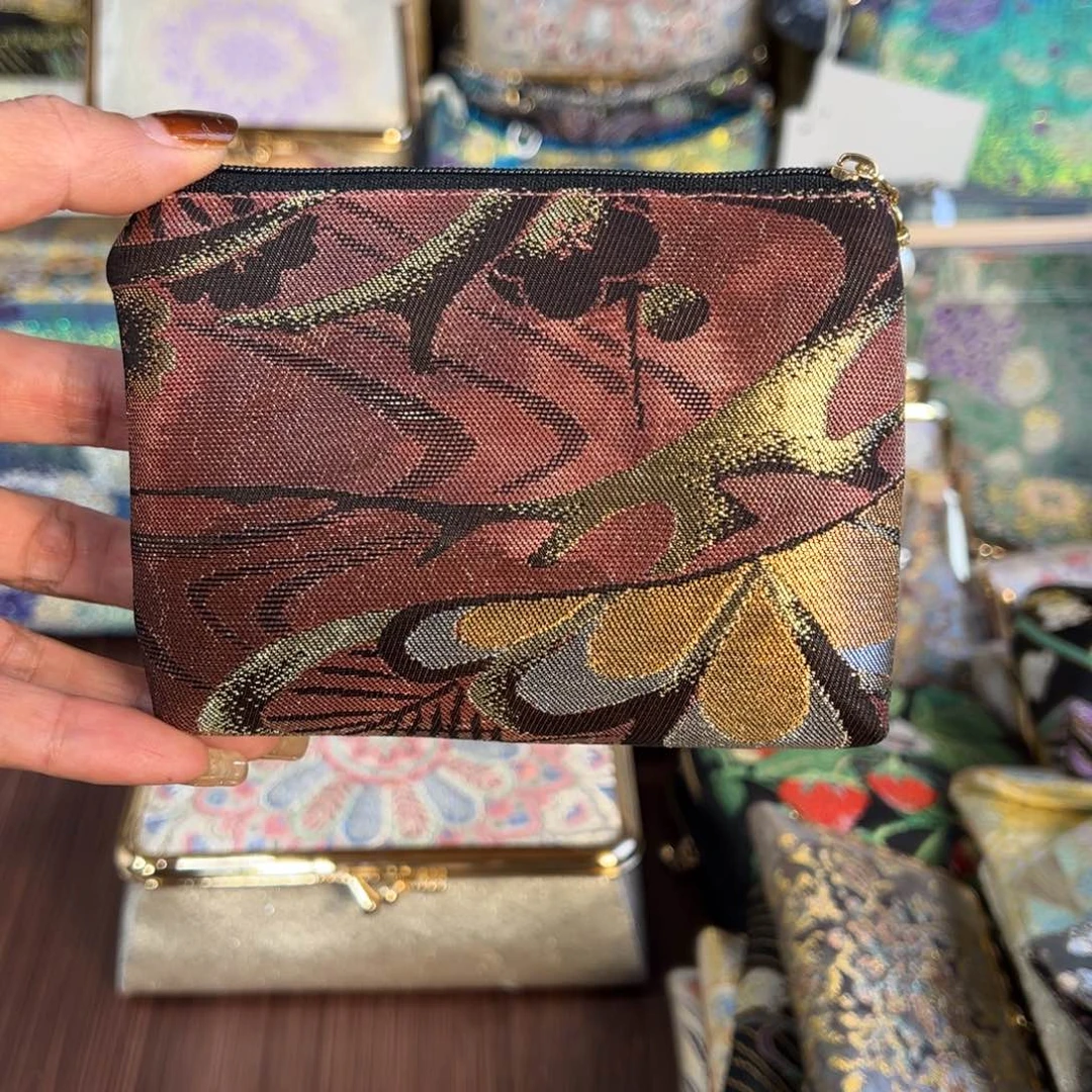 徐***江蚕丝福利拉链零钱包