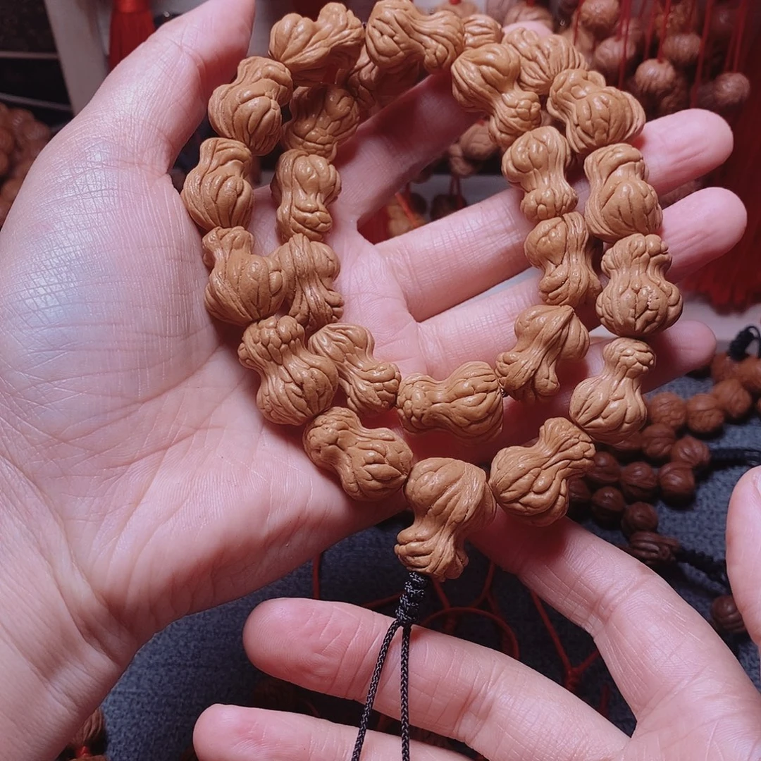 桃核吊坠桃枭手持