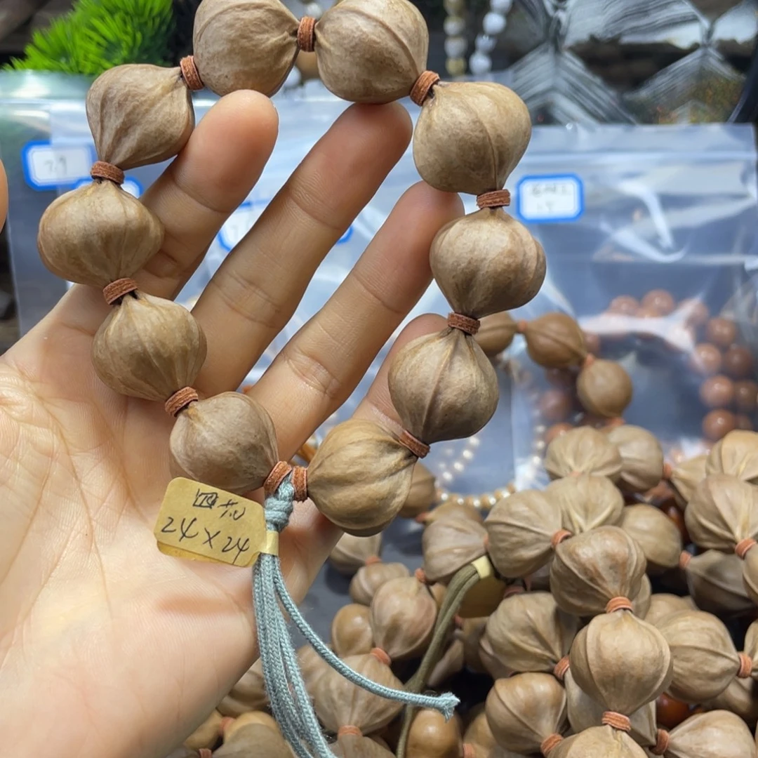 @***@橄榄核吊坠2424铁核四花