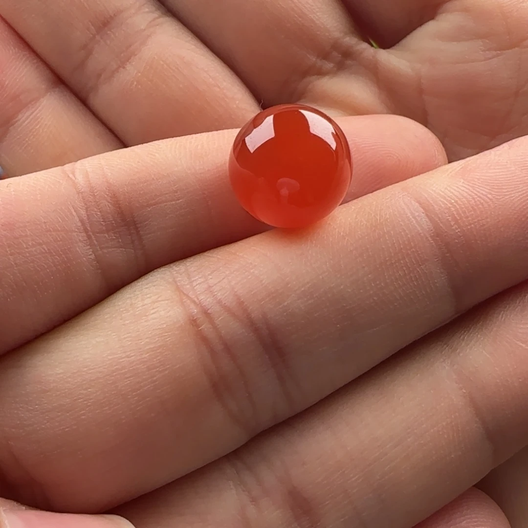 南红玛瑙未镶嵌圆珠：12冰红满砂 无纹