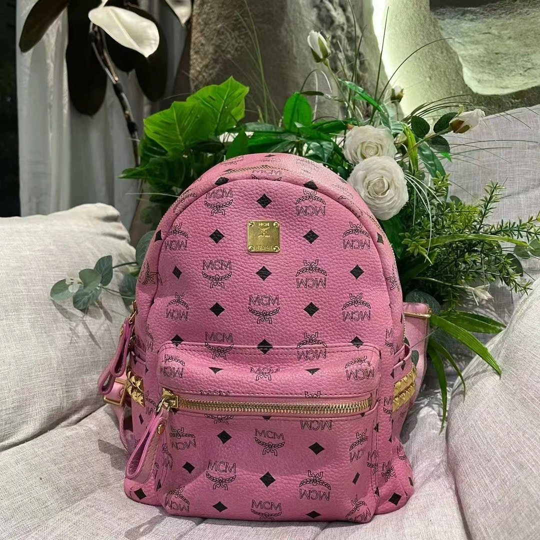 99新 MCM 粉色铆钉小号双肩包 80110