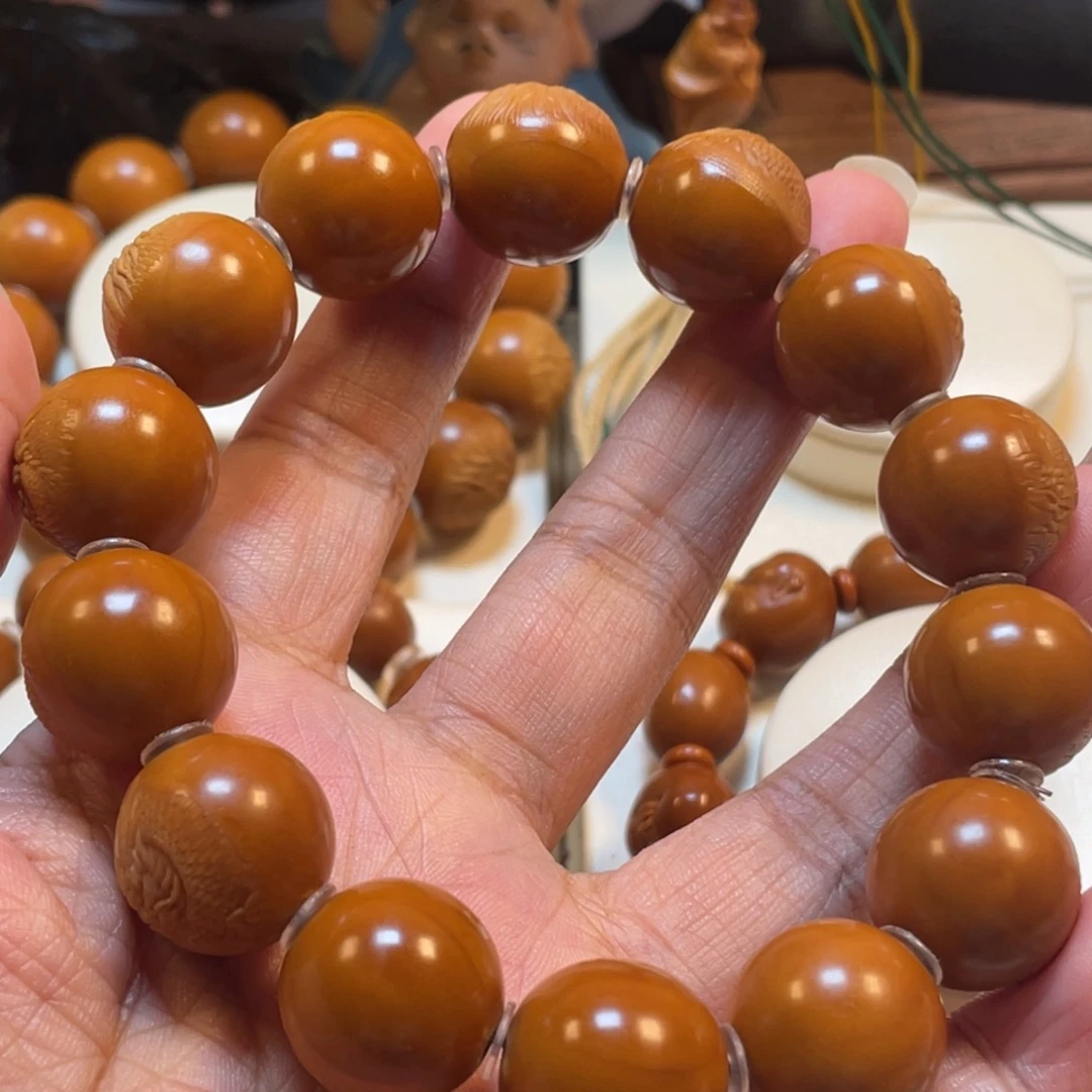 ***正圆光珠龙橄榄核手串