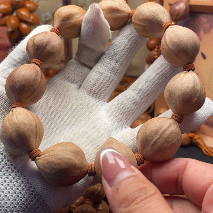 胡***意橄榄核手串/手链2.2原皮三花