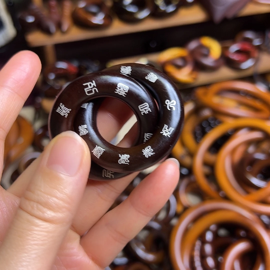 宏***博2.5内径枣木玉化镶银乾坤圈