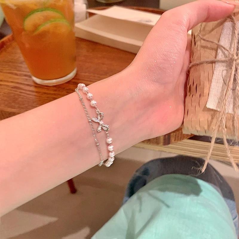 CIOEM KOUIM 铜合金手链 双层蝴蝶结施家珍珠叠戴手链轻奢精致