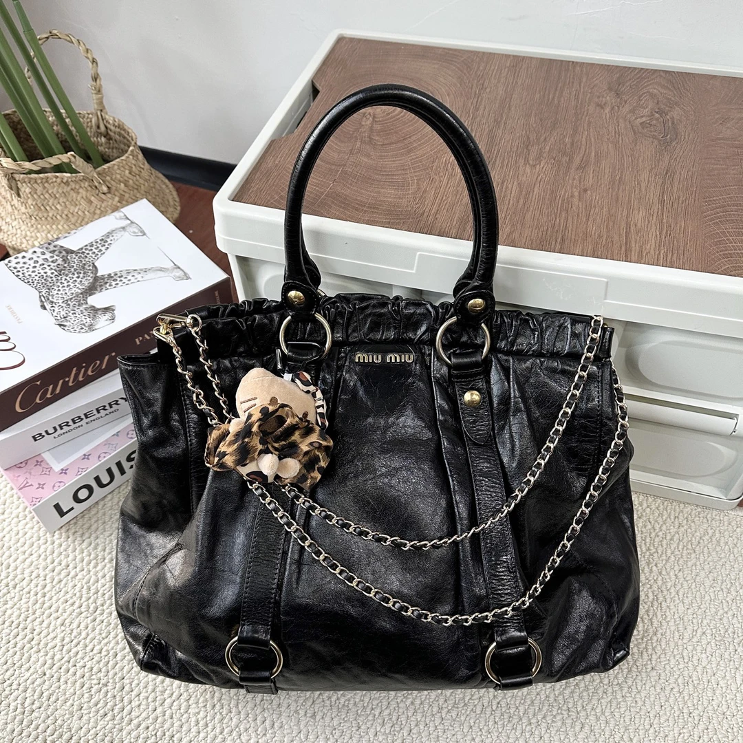 99新 MIU MIU/缪缪 miumiu黑色斜挎包手提包机车包