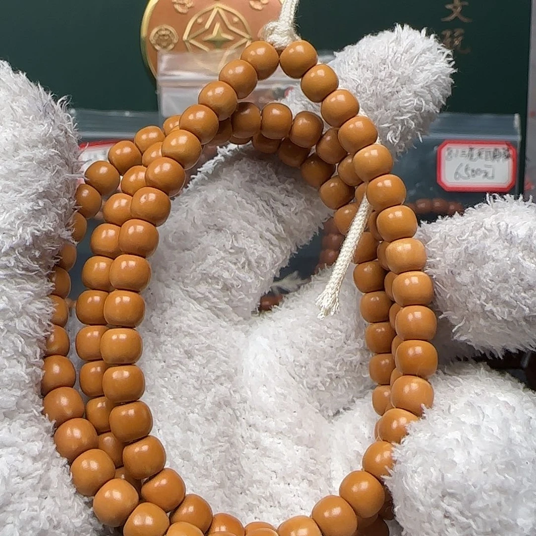 吊坠橄榄核6.6mm老挝核尖长串福利款微白