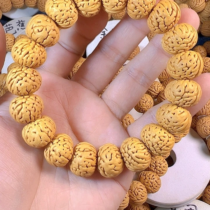 哦***哦手串桃核板鸭树王纽扣