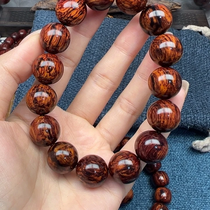 米***生木海南红降花梨公树心油爆满妖纹1.5圆珠